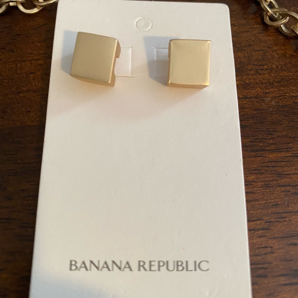 Square gold earrings.